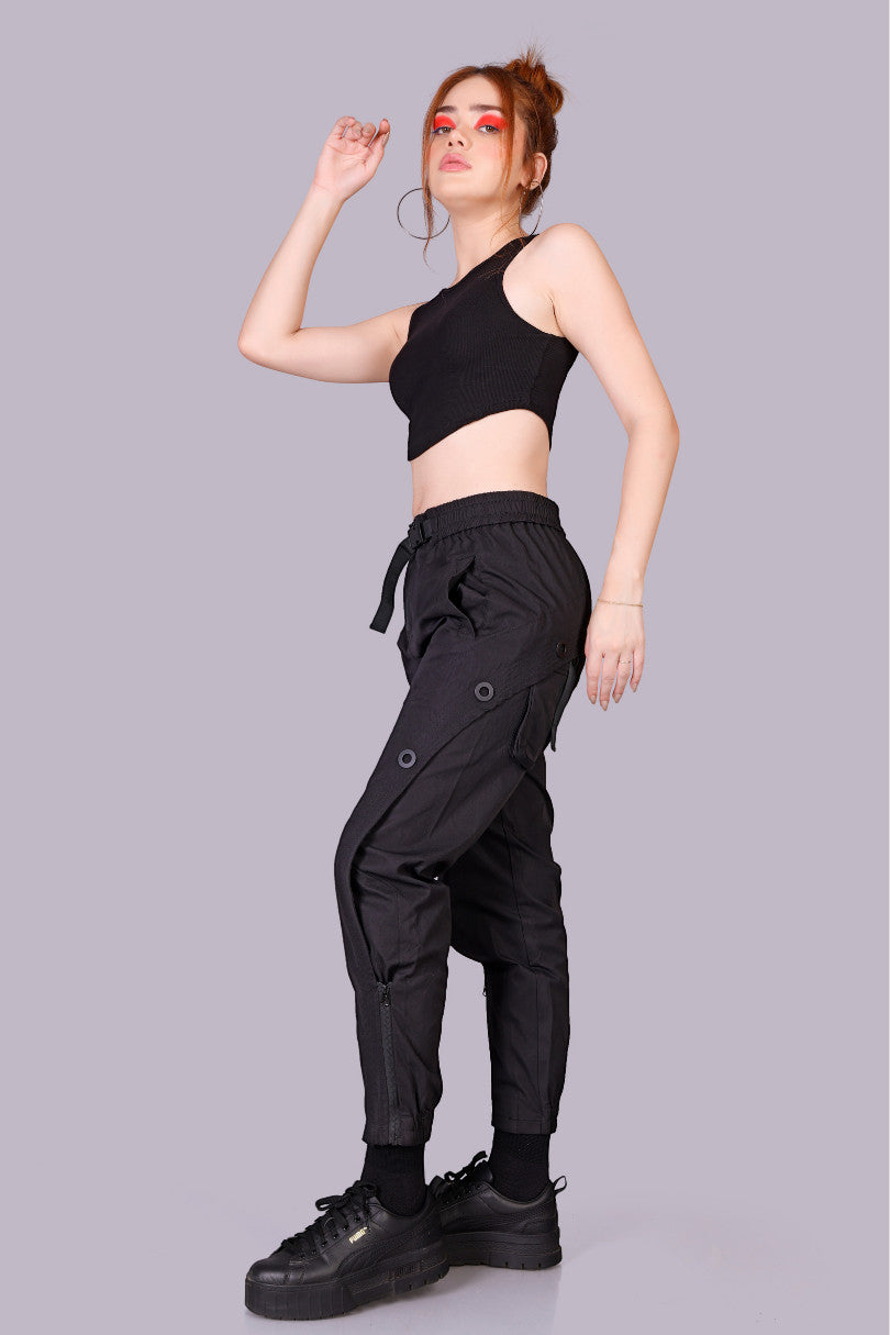METTLE TWEED black polyester-spandex cargo pants with adjustable waist, utility pockets, and zippered ankles.