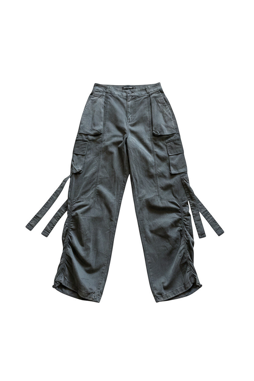 METTLE TWEED Peepal wide-leg cargo pants in grey with oversized flap pockets and dangling straps.