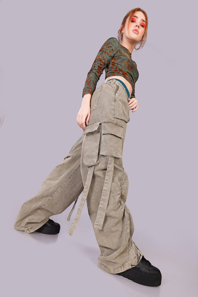 METTLE TWEED Peepal wide-leg cargo pants in washed khaki with oversized flap pockets and dangling straps.