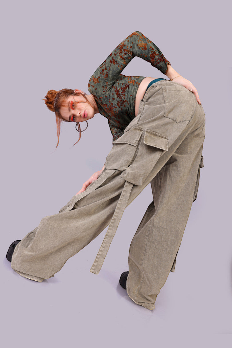 METTLE TWEED Peepal wide-leg cargo pants in washed khaki with oversized flap pockets and dangling straps.