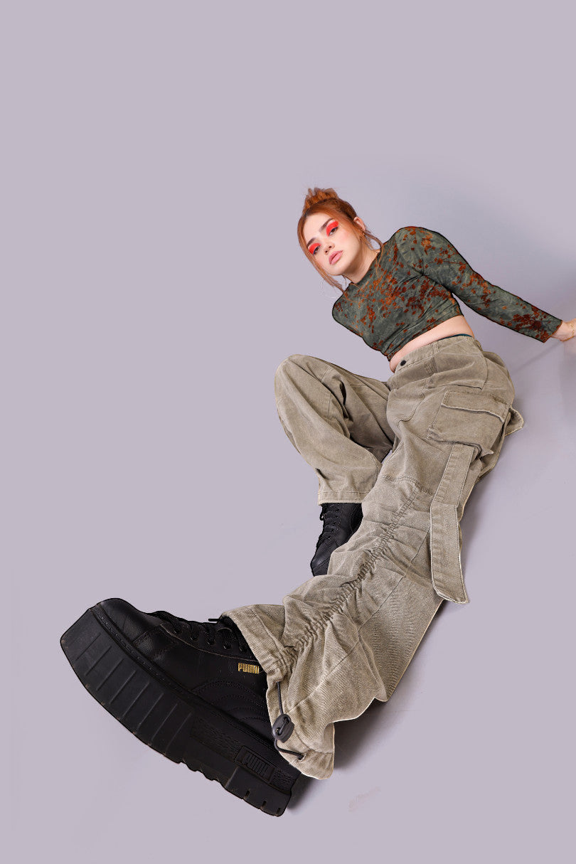 METTLE TWEED Peepal wide-leg cargo pants in washed khaki with oversized pockets and dangling straps.